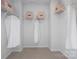 Organized closet space with shelving, hanging storage, and neutral carpeting at 5604 Kingspan Dr, Charlotte, NC 28217