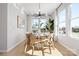 Sunlit dining area showcases a modern chandelier, large windows, and a round table at 5604 Kingspan Dr, Charlotte, NC 28217