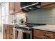Contemporary kitchen with stainless steel appliances and tiled backsplash at 5604 Kingspan Dr, Charlotte, NC 28217