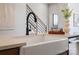 Close up on the Kitchen sink with a quartz countertop and contemporary faucet at 5604 Kingspan Dr, Charlotte, NC 28217