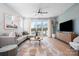 Spacious living room with neutral decor, a large sectional sofa, and access to an outdoor balcony at 5604 Kingspan Dr, Charlotte, NC 28217