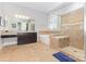 Bright bathroom featuring a large soaking tub, glass-enclosed shower, and granite countertops at 5706 Sardis Hall Ct, Charlotte, NC 28270