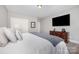 Bright bedroom features soft carpet, a large television, and ample closet space at 5706 Sardis Hall Ct, Charlotte, NC 28270