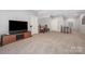 Large bonus room with neutral carpet, a television and bar area, and lots of space for entertaining at 5706 Sardis Hall Ct, Charlotte, NC 28270