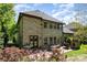 Back of brick home with a patio, dining area, and a grill at 5706 Sardis Hall Ct, Charlotte, NC 28270