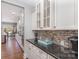 Kitchen with granite countertops, mosaic backsplash, stainless appliances, and lots of cabinet space at 5706 Sardis Hall Ct, Charlotte, NC 28270