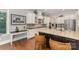 Modern kitchen with a center island, granite countertops, stainless steel appliances, and lots of counter space at 5706 Sardis Hall Ct, Charlotte, NC 28270