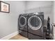Laundry room with a large washer and dryer at 5706 Sardis Hall Ct, Charlotte, NC 28270