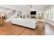 Bright living room with fireplace, built-in shelves and hardwood flooring at 5706 Sardis Hall Ct, Charlotte, NC 28270