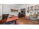 Office area with built in bookcases and hardwood floors at 5706 Sardis Hall Ct, Charlotte, NC 28270