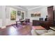 Bright home office featuring hardwood floors, large windows, and a spacious desk area at 5706 Sardis Hall Ct, Charlotte, NC 28270