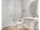 Small powder room with tile flooring and a pedestal sink at 5706 Sardis Hall Ct, Charlotte, NC 28270