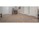 Carpeted area with a staircase and a wooden railing at 5706 Sardis Hall Ct, Charlotte, NC 28270