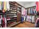 Spacious walk-in closet with built-in shelves and wood floors at 5706 Sardis Hall Ct, Charlotte, NC 28270