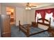 Primary bedroom features wood furniture, blue carpet, and natural lighting at 648 Dobson Farm Rd, Statesville, NC 28625