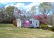 Charming single-story home with a well-maintained lawn and mature landscaping at 648 Dobson Farm Rd, Statesville, NC 28625
