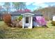Inviting home exterior featuring a covered entrance and colorful shrubbery at 648 Dobson Farm Rd, Statesville, NC 28625