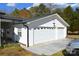 Attached two-car garage with white doors and exterior, offering convenient parking and storage at 648 Dobson Farm Rd, Statesville, NC 28625