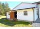 Side view of the back of the home, featuring siding and an open doorway at 648 Dobson Farm Rd, Statesville, NC 28625