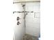Bright and modern shower with grey stone tile, dual shower heads, and storage niche at 648 Dobson Farm Rd, Statesville, NC 28625