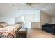 Lofted bedroom with unique ceiling, cozy furnishings, and plentiful lighting at 7215 Meyer Rd, Fort Mill, SC 29715