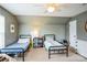 Bedroom featuring two twin beds, a ceiling fan, and natural light at 7215 Meyer Rd, Fort Mill, SC 29715