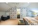 Charming bedroom showcasing decorative wallpaper, an ensuite bath, and ample natural light at 7215 Meyer Rd, Fort Mill, SC 29715
