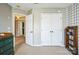 View of a cozy bedroom with a double door closet and an open doorway at 7215 Meyer Rd, Fort Mill, SC 29715