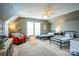 bedroom offering two twin beds, a red arm chair, ceiling fan, and natural light at 7215 Meyer Rd, Fort Mill, SC 29715