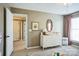 Bedroom featuring a changing table, patterned rug, and natural light at 7215 Meyer Rd, Fort Mill, SC 29715