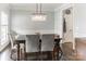 Dining room with modern lighting, neutral colors, and hardwood flooring at 7215 Meyer Rd, Fort Mill, SC 29715