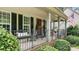 Inviting front porch with decorative railings and porch furniture create an appealing outdoor space at 7215 Meyer Rd, Fort Mill, SC 29715