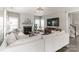 Bright living room featuring a fireplace, large sectional, and hardwood floors at 7215 Meyer Rd, Fort Mill, SC 29715
