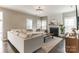 Bright living room featuring a fireplace, large sectional, and hardwood floors at 7215 Meyer Rd, Fort Mill, SC 29715