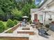 Cozy outdoor living space features a fire pit, seating, and patio, perfect for entertaining at 7215 Meyer Rd, Fort Mill, SC 29715