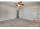 An open bedroom has neutral colors, plush carpet, and a ceiling fan at 722 Sandy Green Ct, Fort Mill, SC 29715