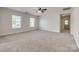 Another angle of the bonus room showing carpet, natural light, and access to other rooms at 722 Sandy Green Ct, Fort Mill, SC 29715