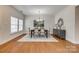 Elegant dining room with hardwood floors, modern chandelier, and stylish furniture at 722 Sandy Green Ct, Fort Mill, SC 29715
