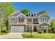 Charming two-story home with stone accents, neutral siding, and a well-manicured front lawn at 722 Sandy Green Ct, Fort Mill, SC 29715