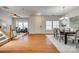 Spacious living room featuring hardwood floors, large windows, and an open floor plan at 722 Sandy Green Ct, Fort Mill, SC 29715