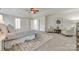 Bright main bedroom with trey ceilings, carpeted floors and a sitting area at 722 Sandy Green Ct, Fort Mill, SC 29715