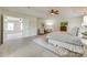 Spacious main bedroom with carpeted floors, a sitting area, trey ceilings, and a ceiling fan at 722 Sandy Green Ct, Fort Mill, SC 29715