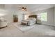 Bright main bedroom with trey ceilings, ceiling fan, a neutral color palette, and carpeted floors at 722 Sandy Green Ct, Fort Mill, SC 29715