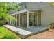 A screened-in porch features string lights, outdoor seating, and concrete flooring at 722 Sandy Green Ct, Fort Mill, SC 29715