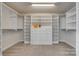 Large walk-in closet with built-in shelving and drawers for ample storage at 722 Sandy Green Ct, Fort Mill, SC 29715