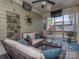 Cozy back porch with comfortable seating, a ceiling fan, and charming decor for outdoor relaxation and entertainment at 815 Digby Rd, Rock Hill, SC 29730