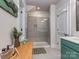 Modern bathroom featuring a glass-enclosed shower, tile floors, and a vanity with a sleek countertop at 815 Digby Rd, Rock Hill, SC 29730