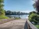 A concrete boat ramp into a river with surrounding trees at 815 Digby Rd, Rock Hill, SC 29730