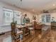 The dining room with hardwood floors offers lots of light and flows into the living room at 815 Digby Rd, Rock Hill, SC 29730