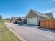 Side exterior view of a well-maintained home with a two-car garage and fenced yard, showcasing its curb appeal at 815 Digby Rd, Rock Hill, SC 29730